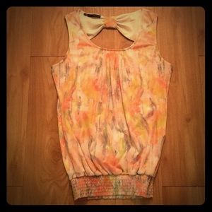 Water color shirt with cut out in the back.